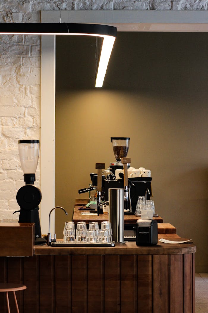 Stylish cafe interior in Saint Petersburg, featuring espresso machines and a minimalist design.